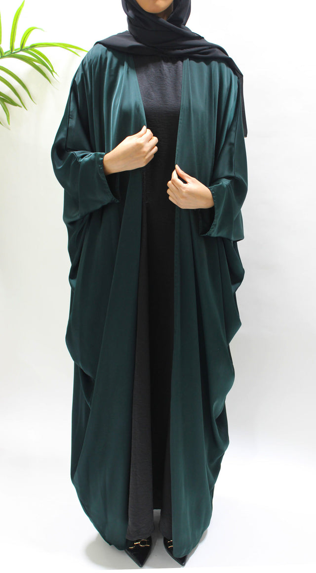 Woman wearing Amani's bottle green farasha abaya set with matching hijab
