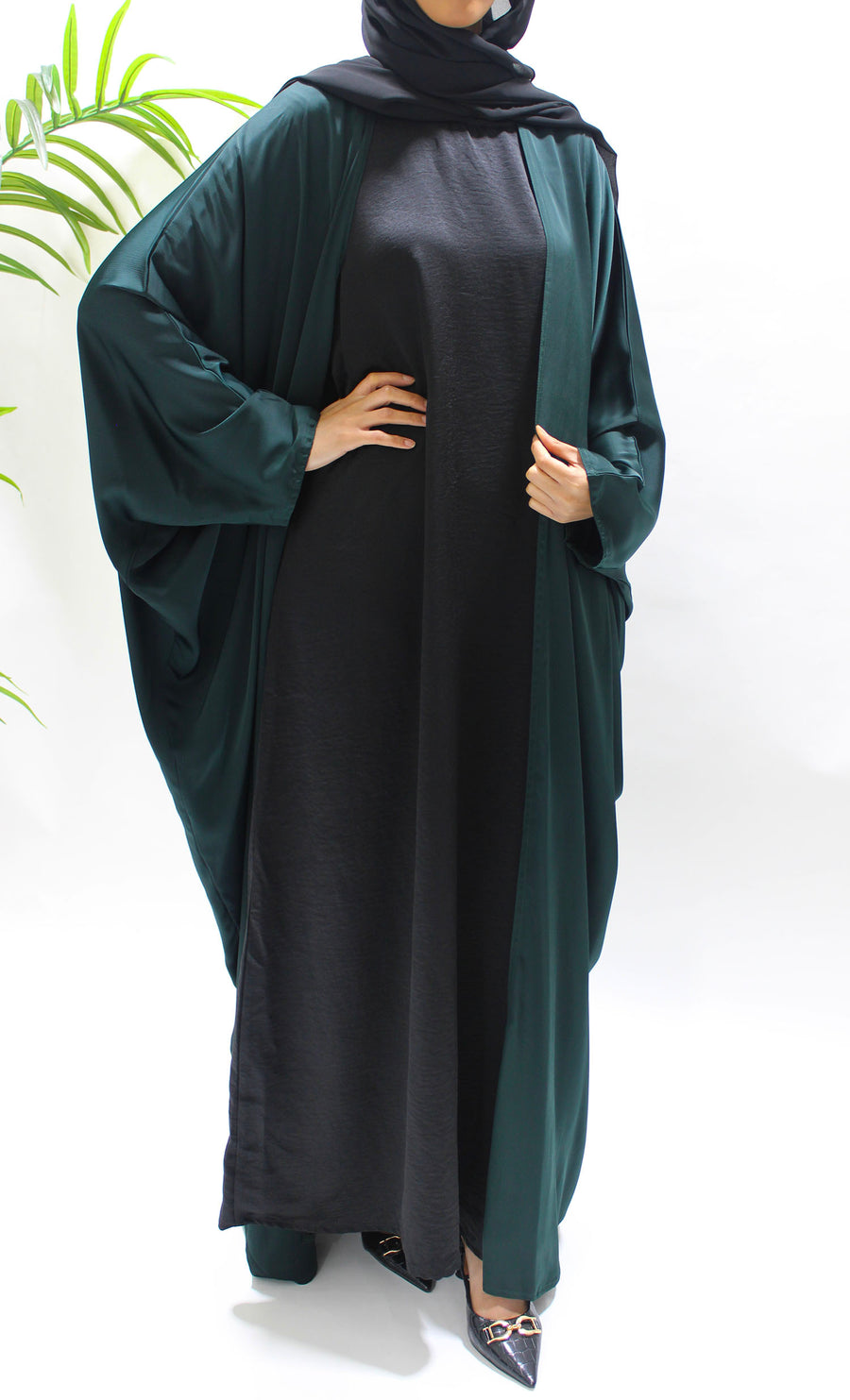 Full-length view of Amani's bottle green farasha abaya set