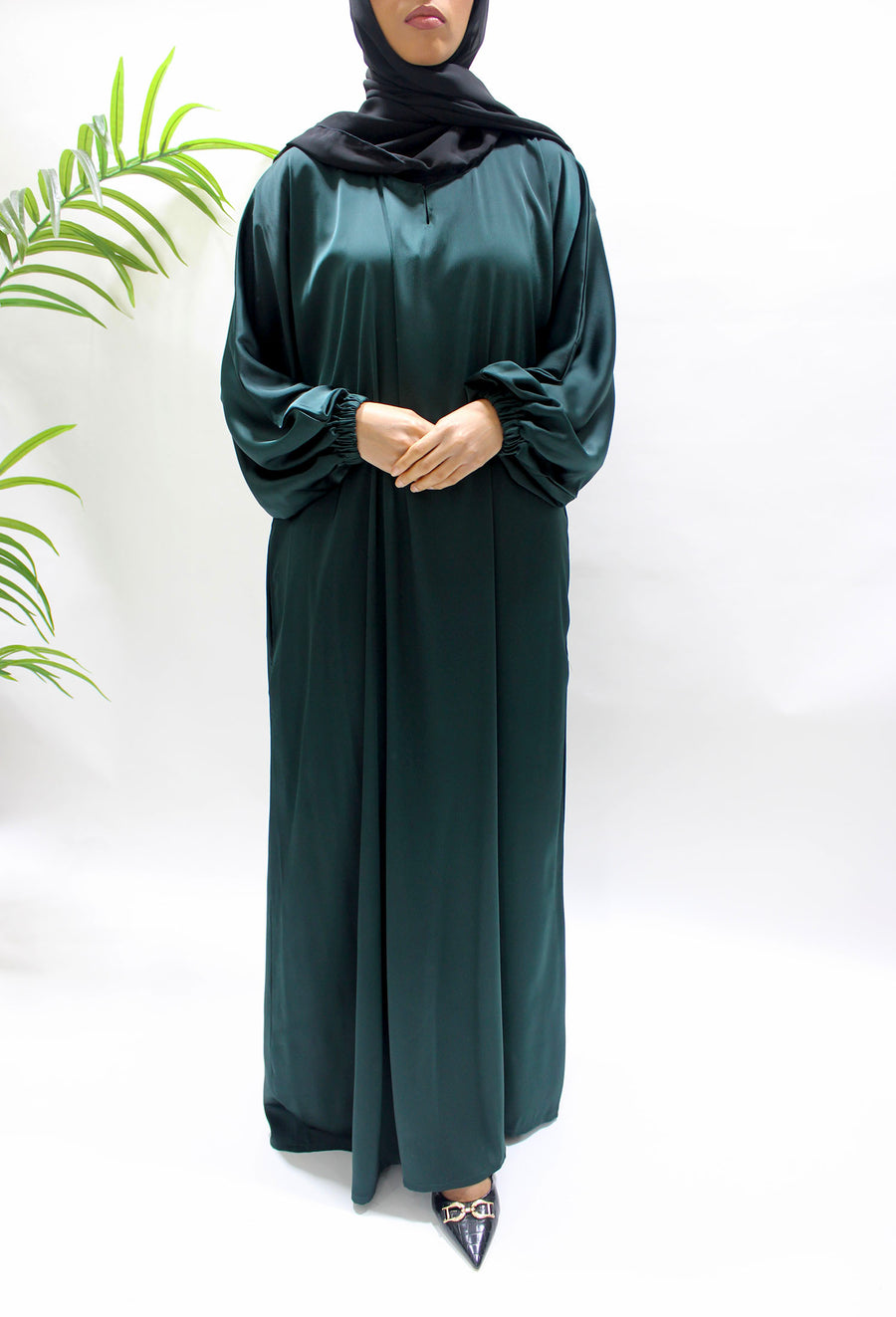 Side pocket on the bottle green textured satin abaya