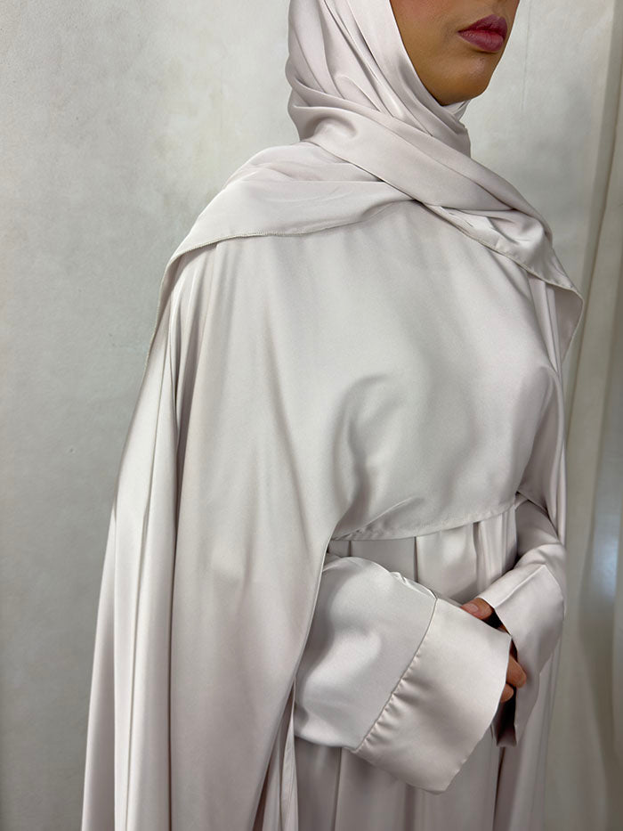 Full-length nude cape abaya set styled for Eid and wedding occasions