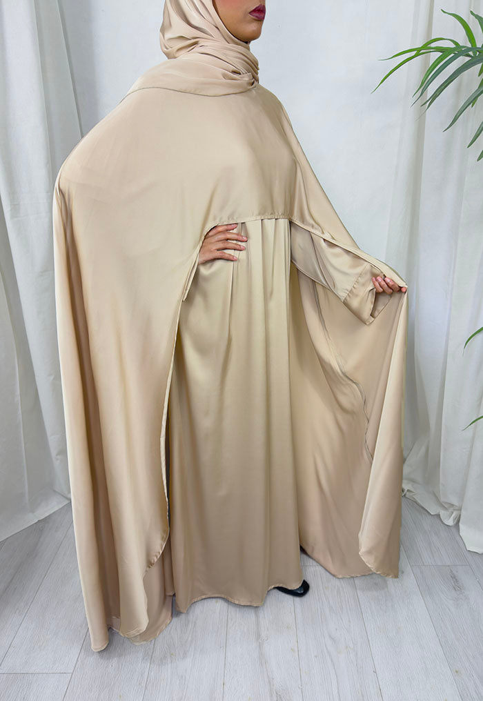 Warm beige Armani satin three-piece cape abaya set styled for Eid and weddings