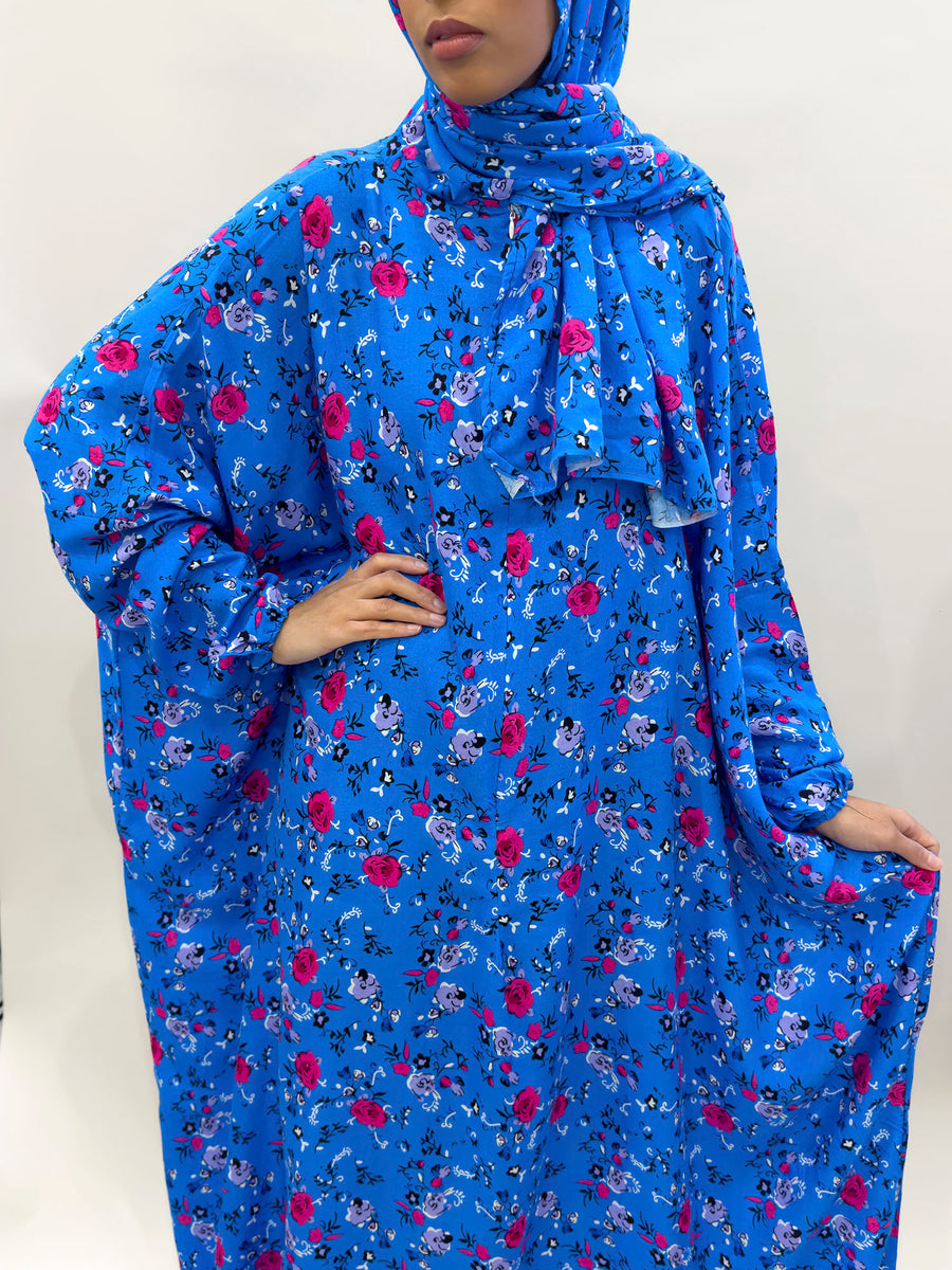 Bright blue floral prayer dress showing the print and elasticated cuffs