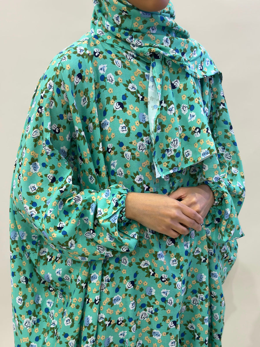 Persian green floral prayer dress showing the attached hijab