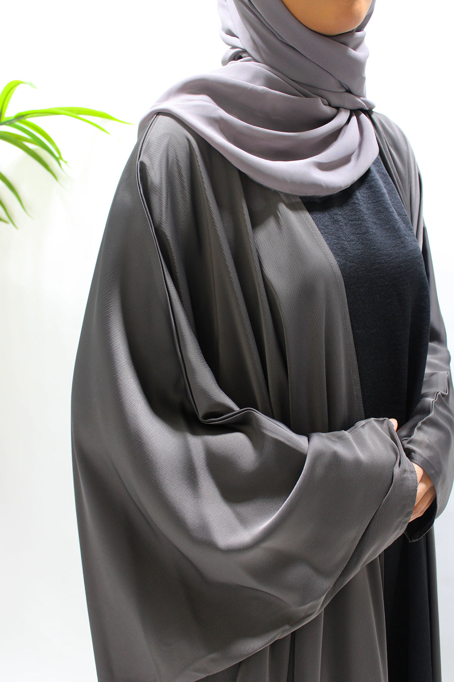Full-length view of Amani's dark taupe farasha abaya set