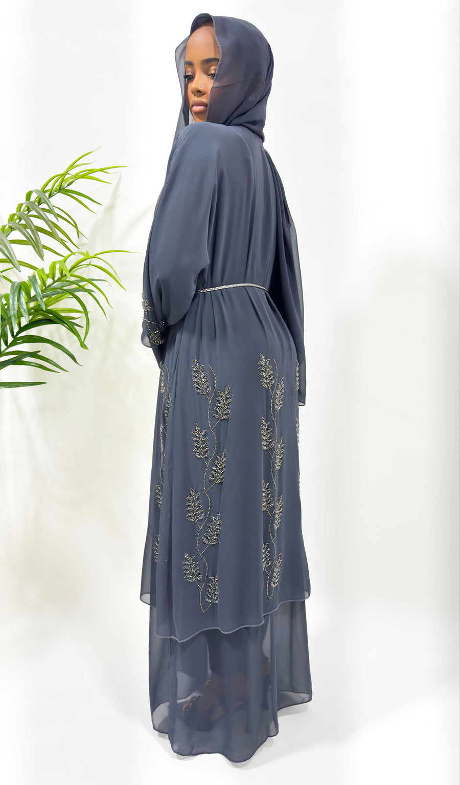Hand-stitched embellishment on the grey chiffon abaya