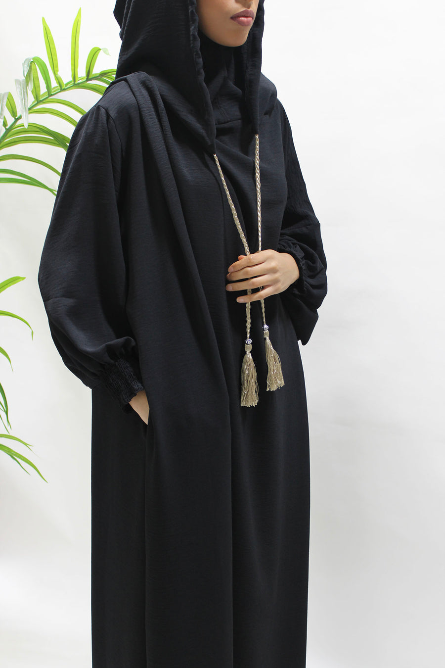 Black prayer abaya showing the ruched cuffs for wudu