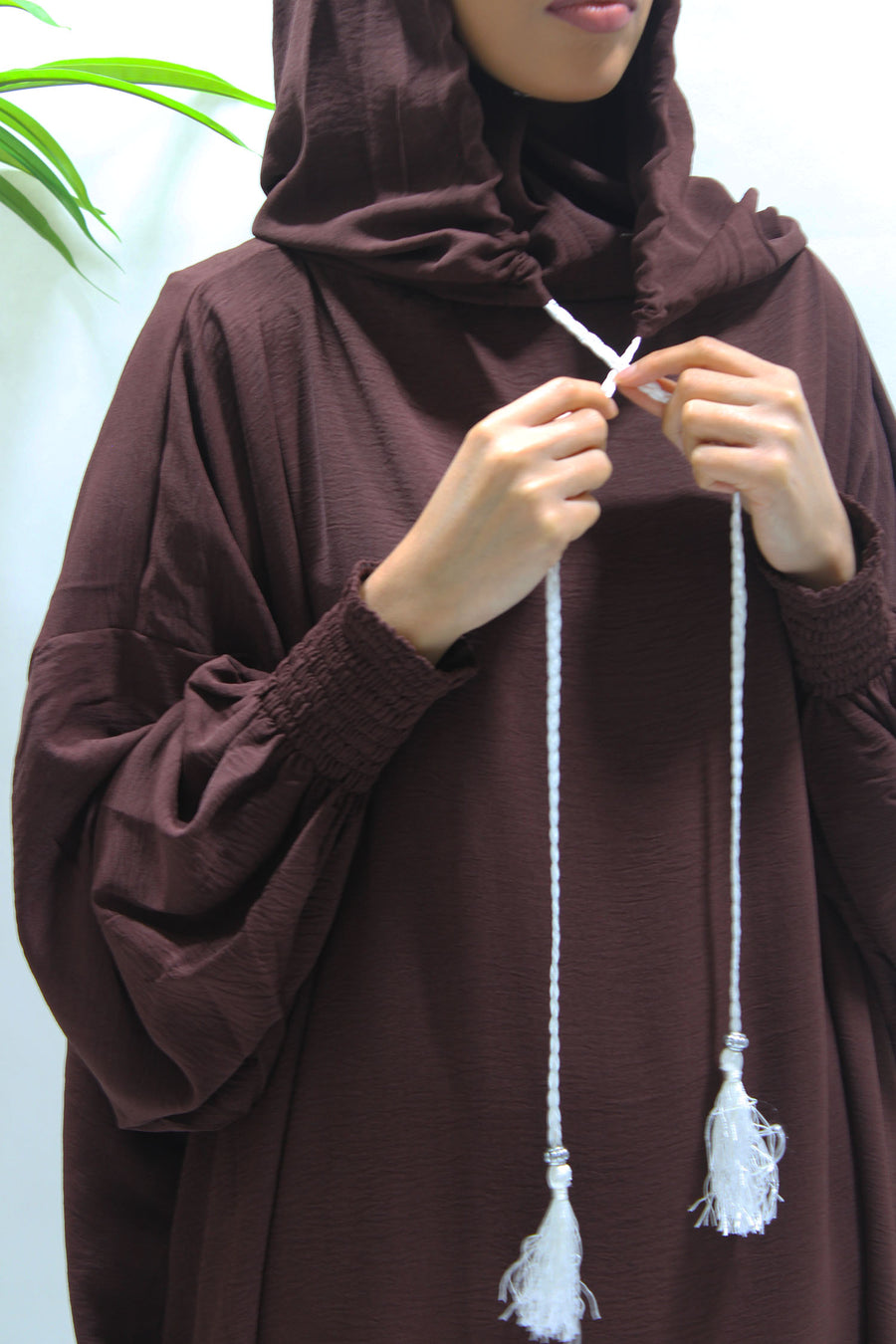 Brown prayer abaya showing the side pockets