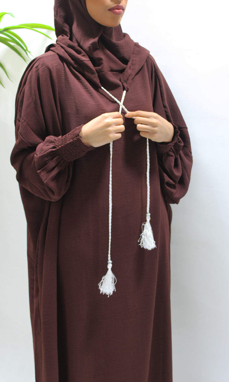 Brown prayer abaya showing the ruched cuffs for wudu