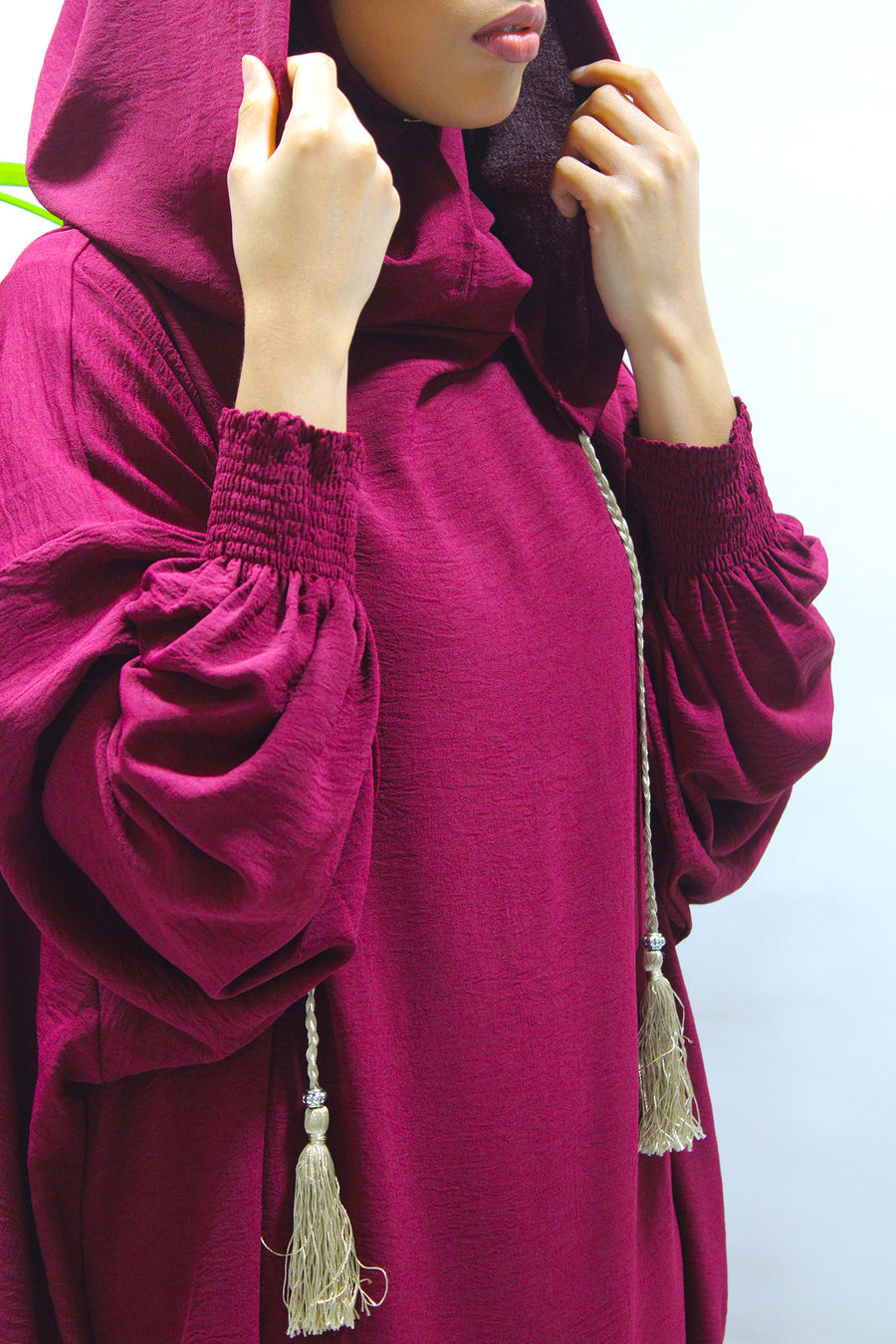 Burgundy prayer abaya showing the side pockets
