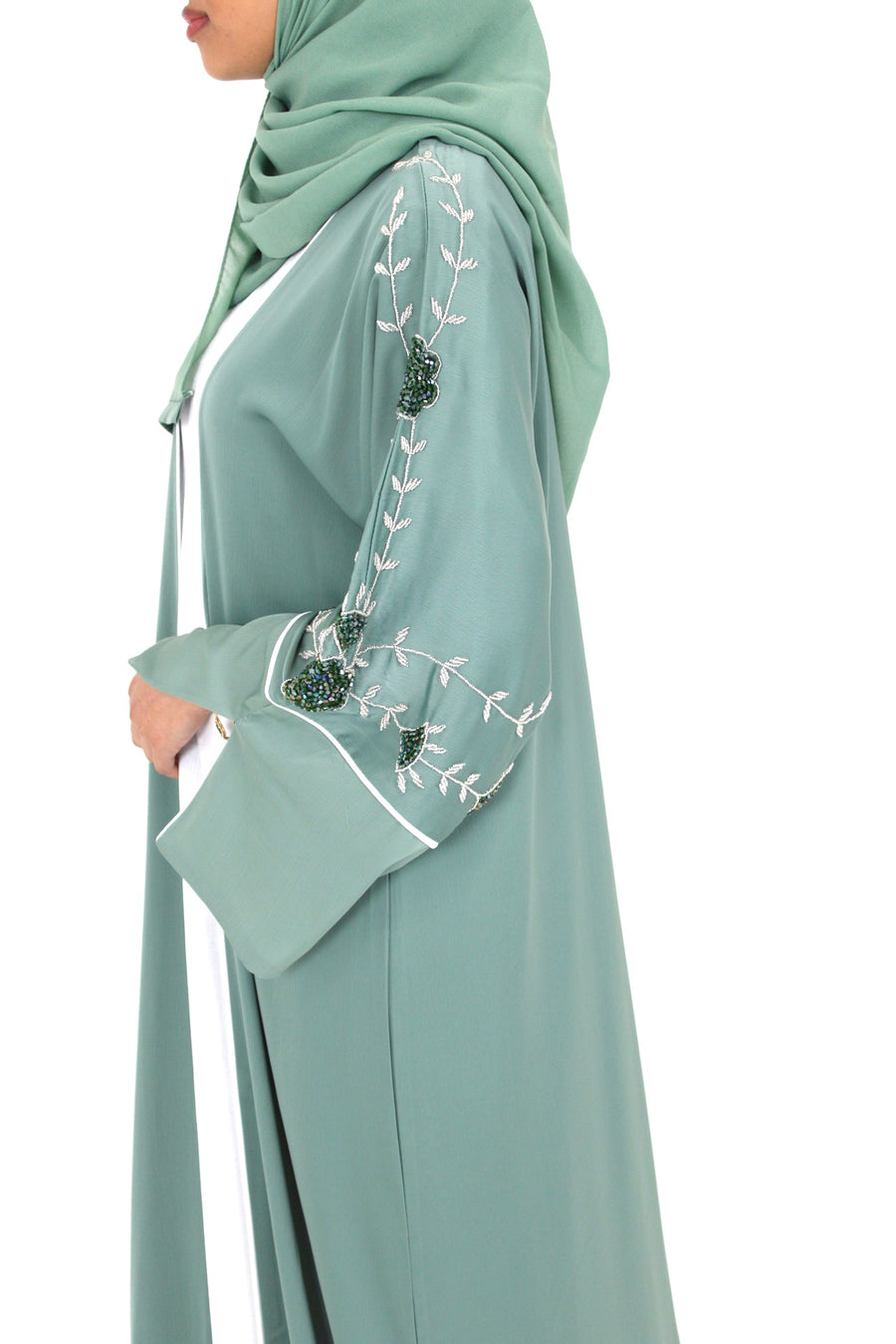 Handmade floral embellishment on the topaz green open abaya