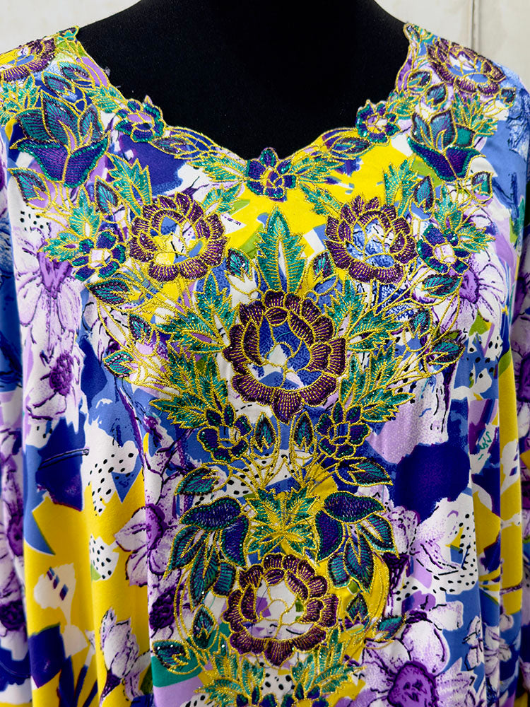Full-length view of Amani's multi floral mukhawar jalabiya dress