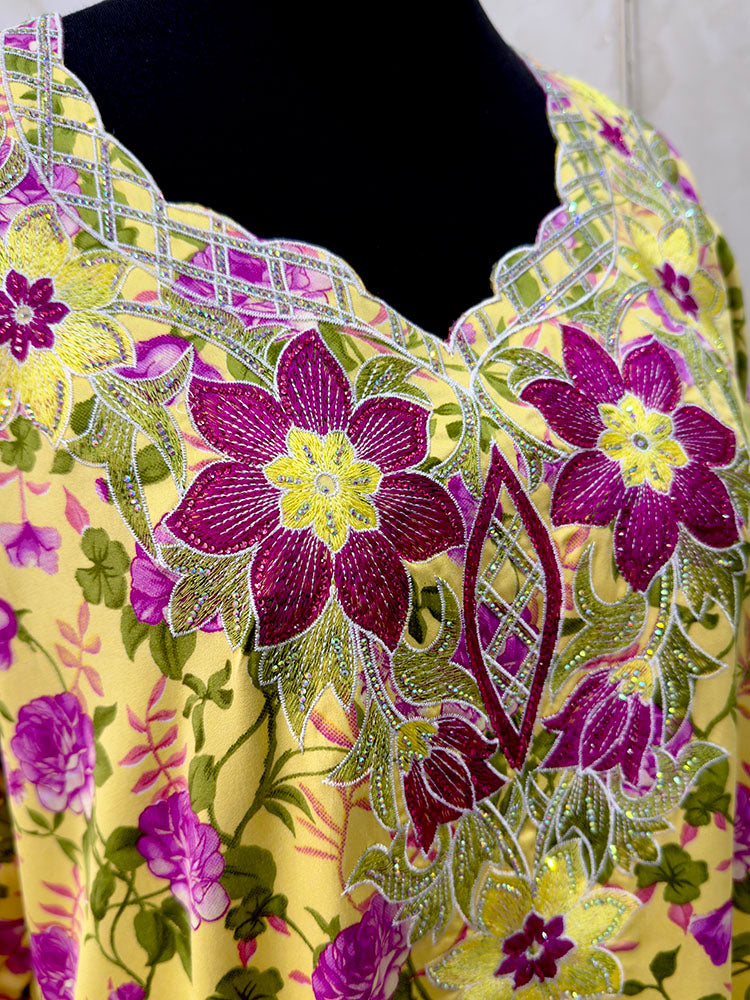 Yellow and fuchsia mukhawar showing the bright floral print