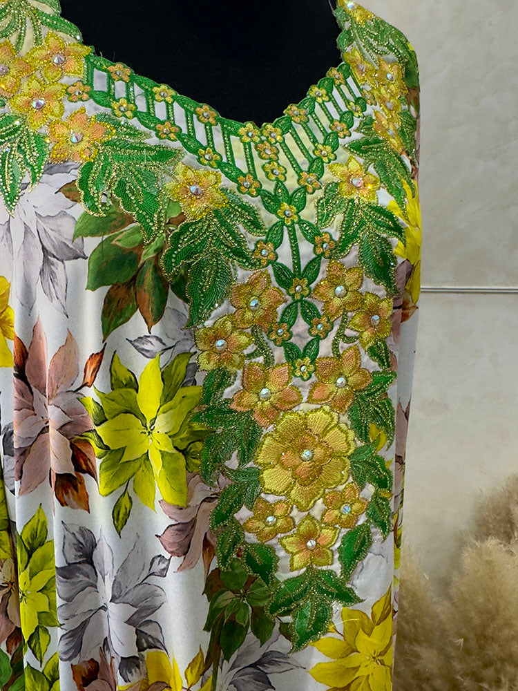 Green and yellow mukhawar showing floral embroidery detail