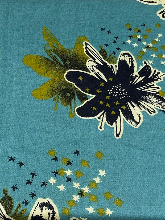 Bright teal floral baati dress showing the all-over floral print