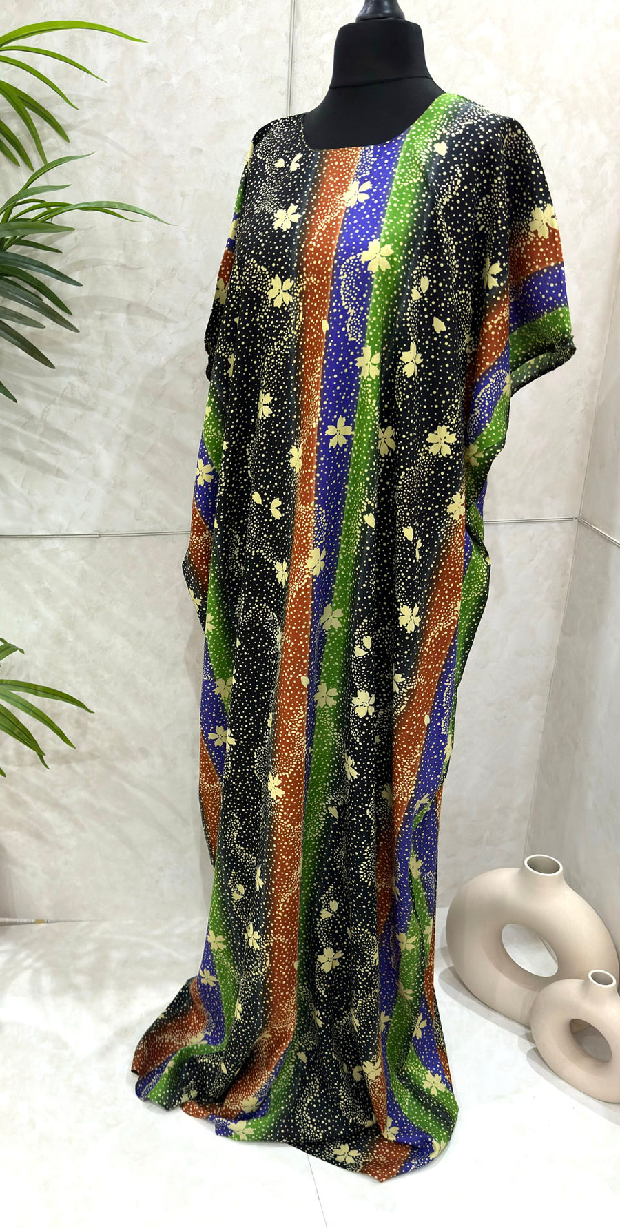 Green floral print cotton baati dress showing the fabric and print detail