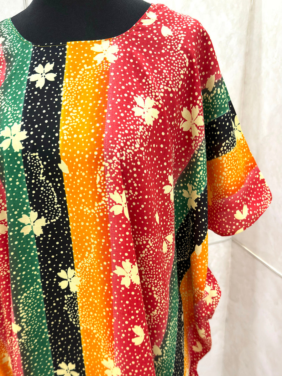 Red floral print cotton baati dress showing the fabric and print detail