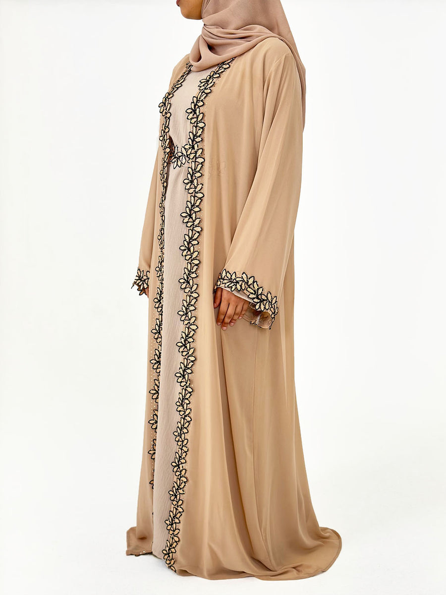 Woman wearing Amani's caramel four-piece lace trim open abaya set