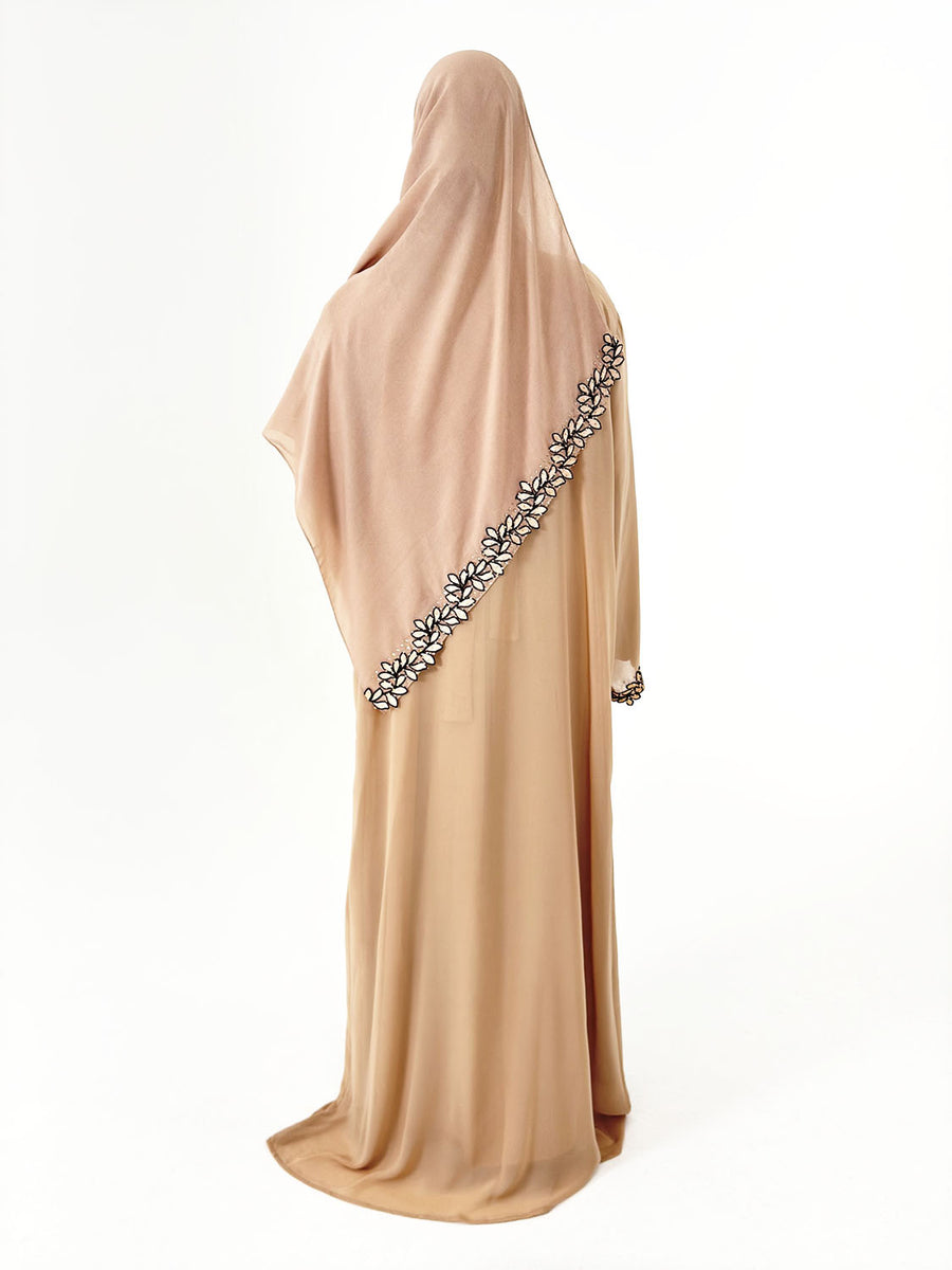 Full-length view of Amani's caramel lace trim open abaya