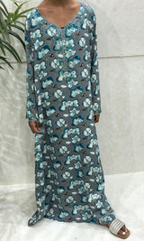 Little girl wearing Amani's Mykonos blue floral mukhawar dress