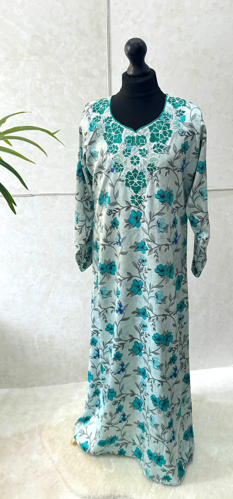 Embroidery and crystal neckline on the turquoise girls' mukhawar dress