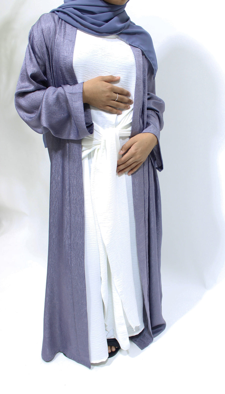 Girl wearing Amani's lilac open jacket abaya set with inner dress and scarf