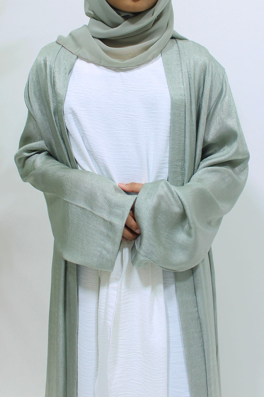 Full-length view of Amani's sage green girls' open jacket abaya set