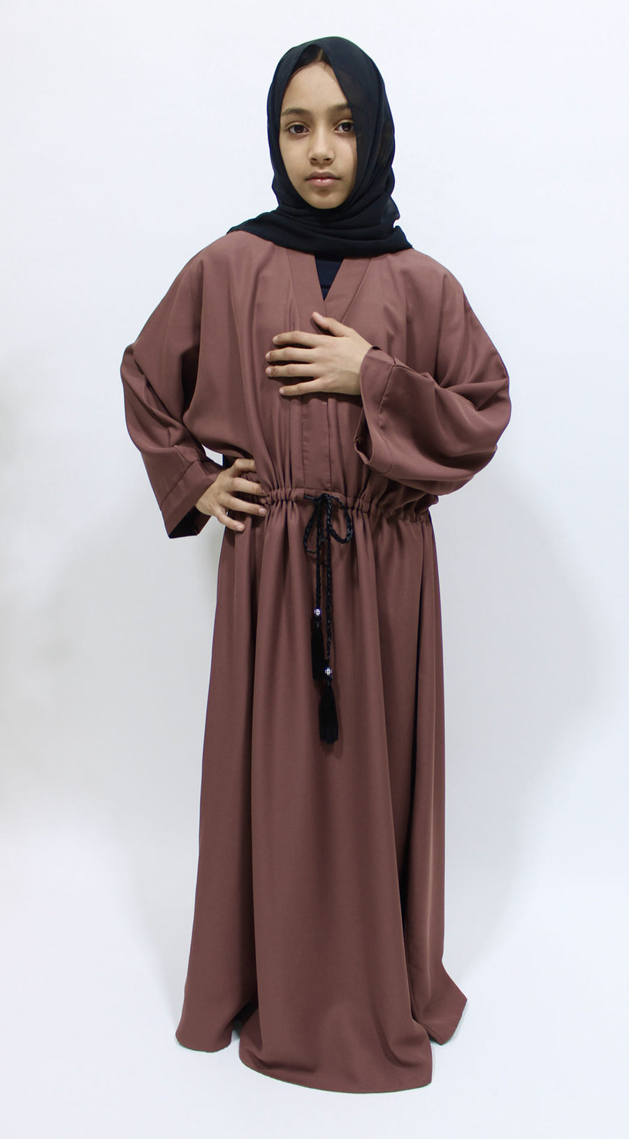 Girl wearing Amani's dark blush draw string abaya with matching scarf