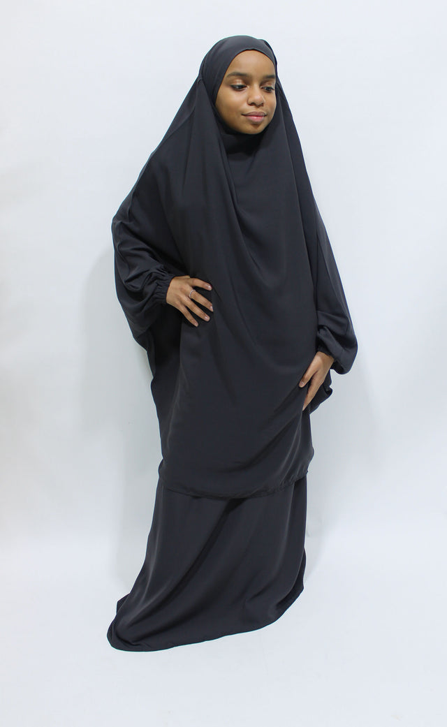 Girl wearing Amani's dark grey jilbab and skirt set with half-jilbab top