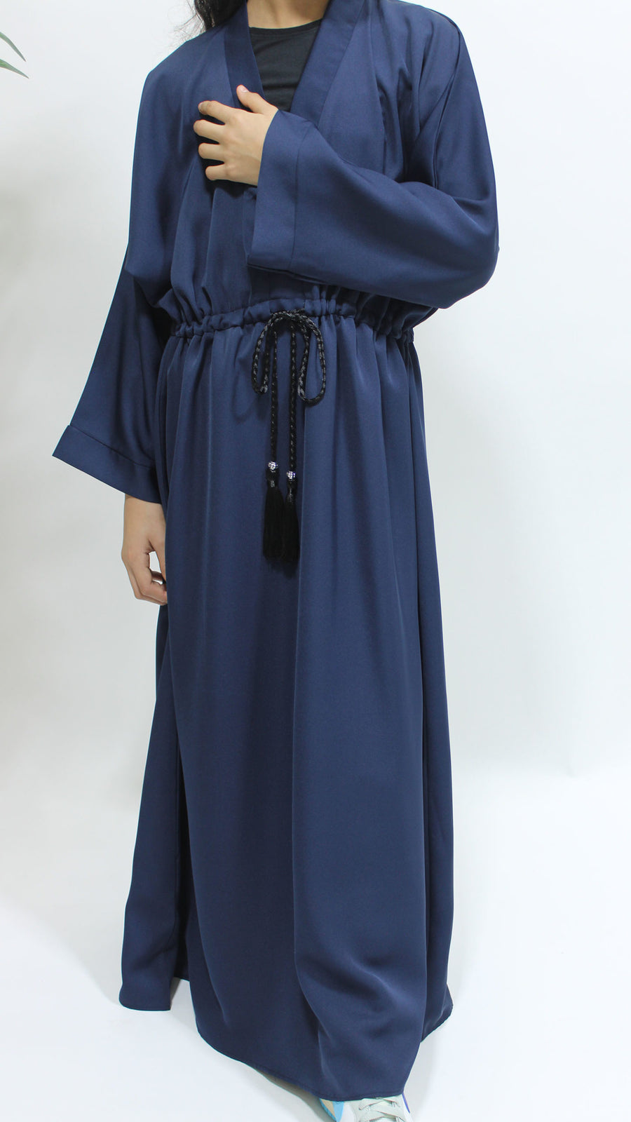 Navy blue girls' abaya showing the lace border detail
