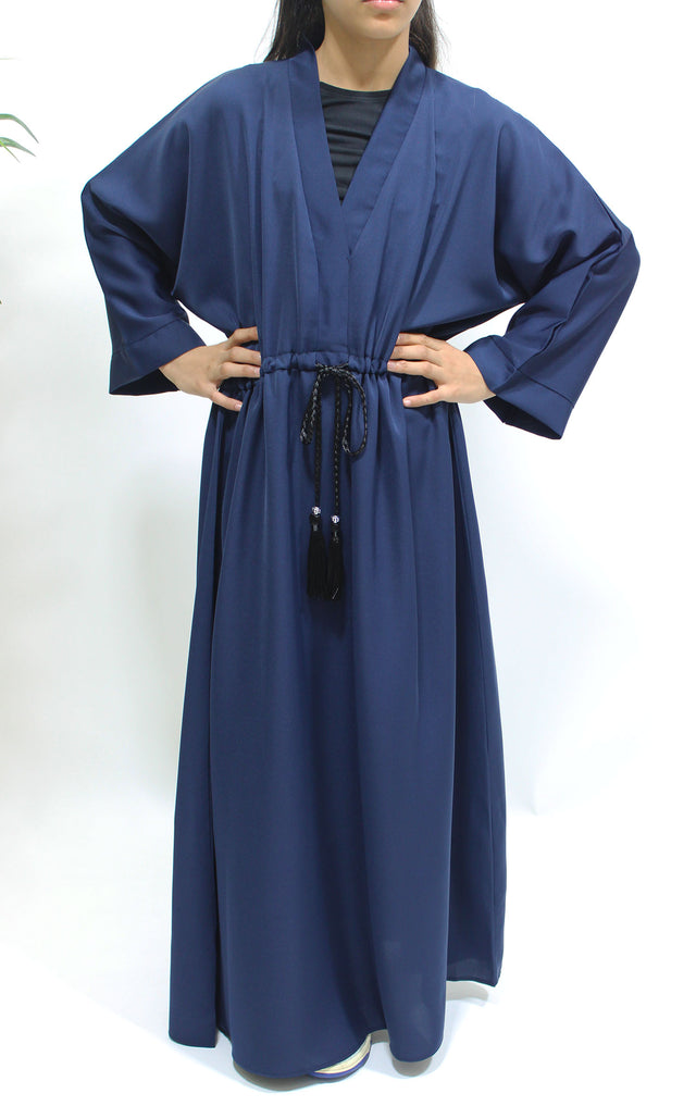 Girl wearing Amani's navy blue draw string abaya with matching scarf