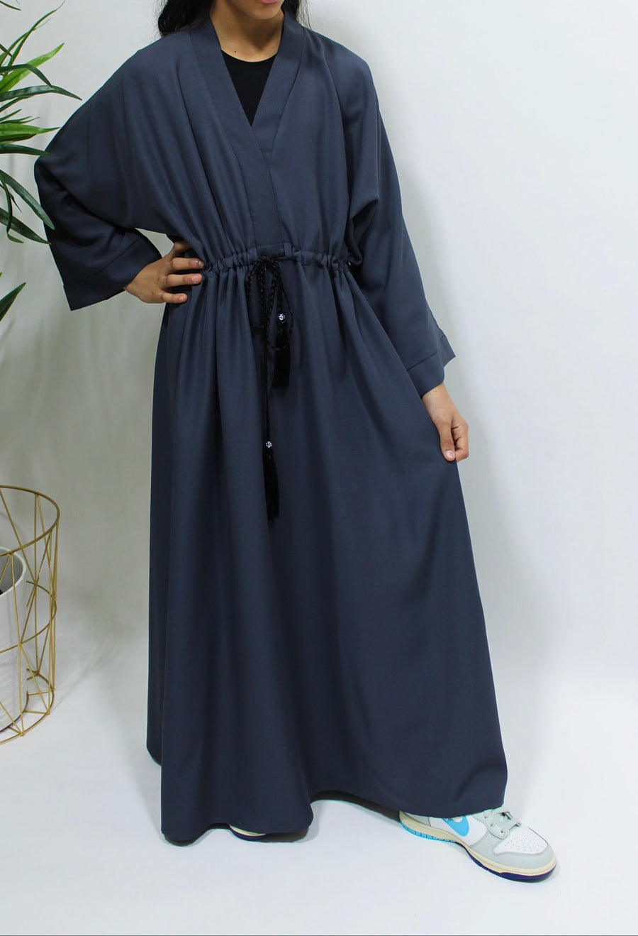 Full-length view of Amani's slate grey girls' draw string abaya