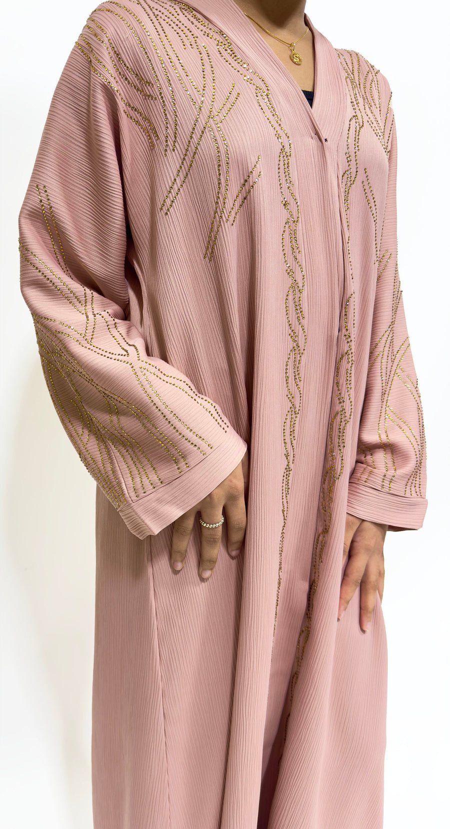 Gold diamante stone detail on the blush girls' open abaya