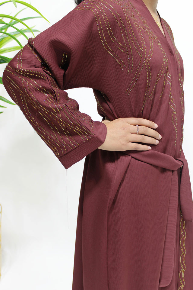 Girl wearing Amani's plum gold embellished open abaya with scarf