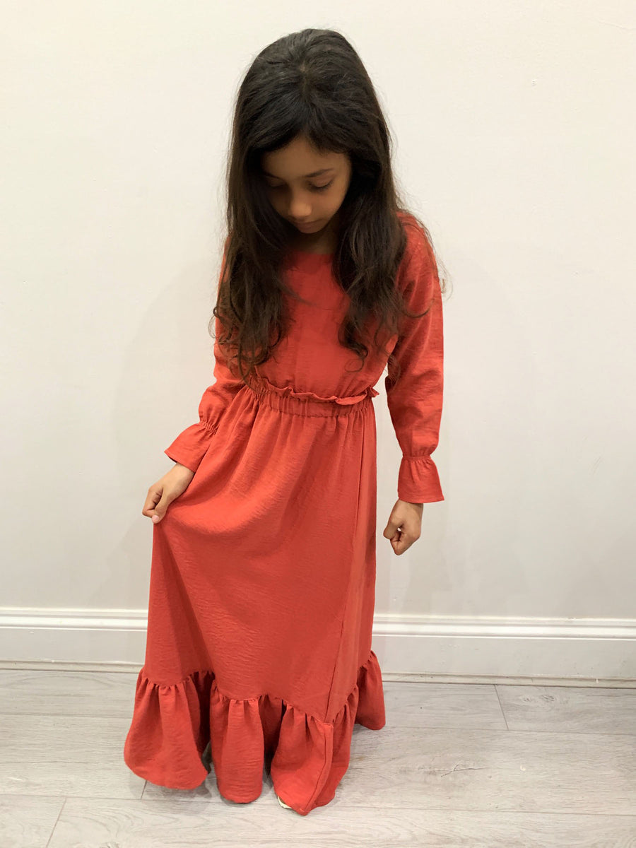 Full-length view of Amani's Haya coral maxi dress