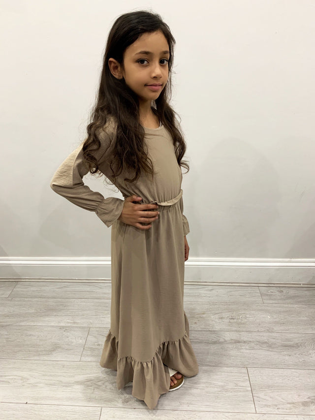 Girl wearing Amani's Haya sand long-sleeve maxi dress