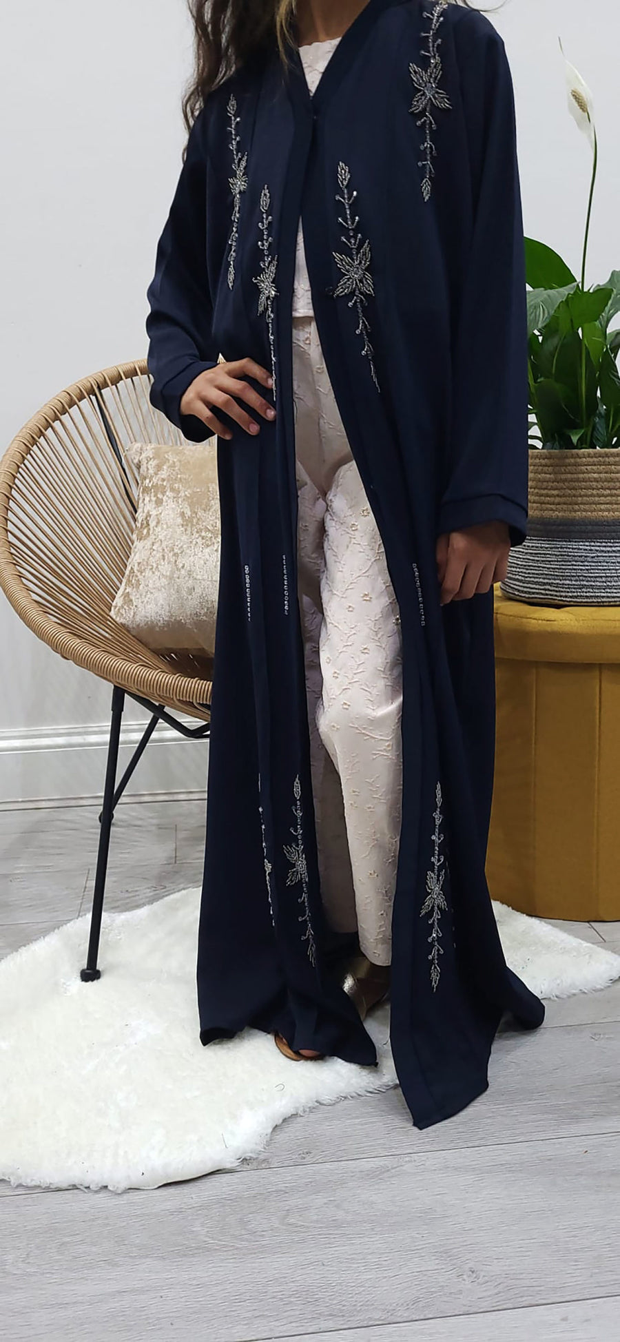 Full-length view of Amani's navy handmade beaded open abaya