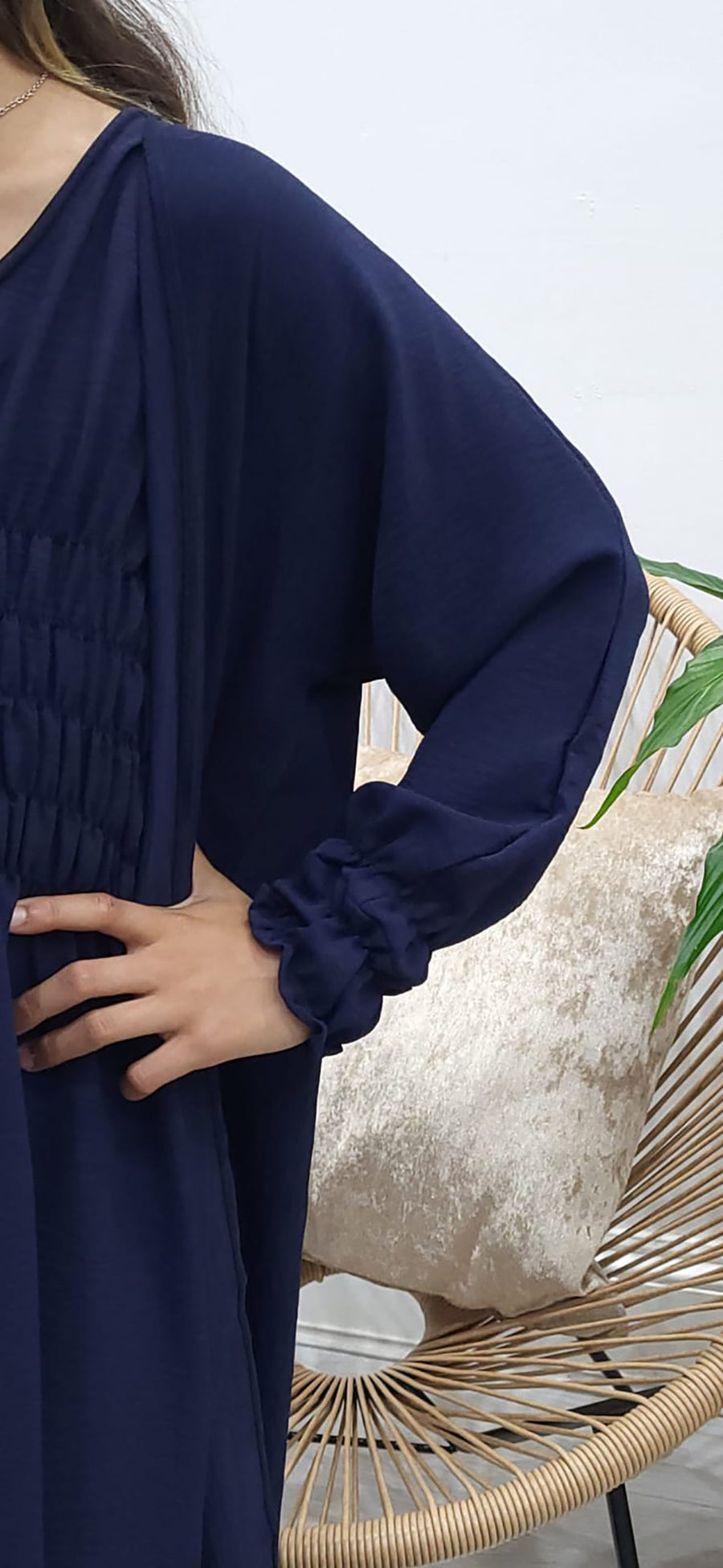 Full-length view of Amani's navy blue jacket-style abaya set