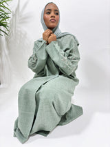 Greenish grey linen blend bisht abaya worn open with matching hijab, front view