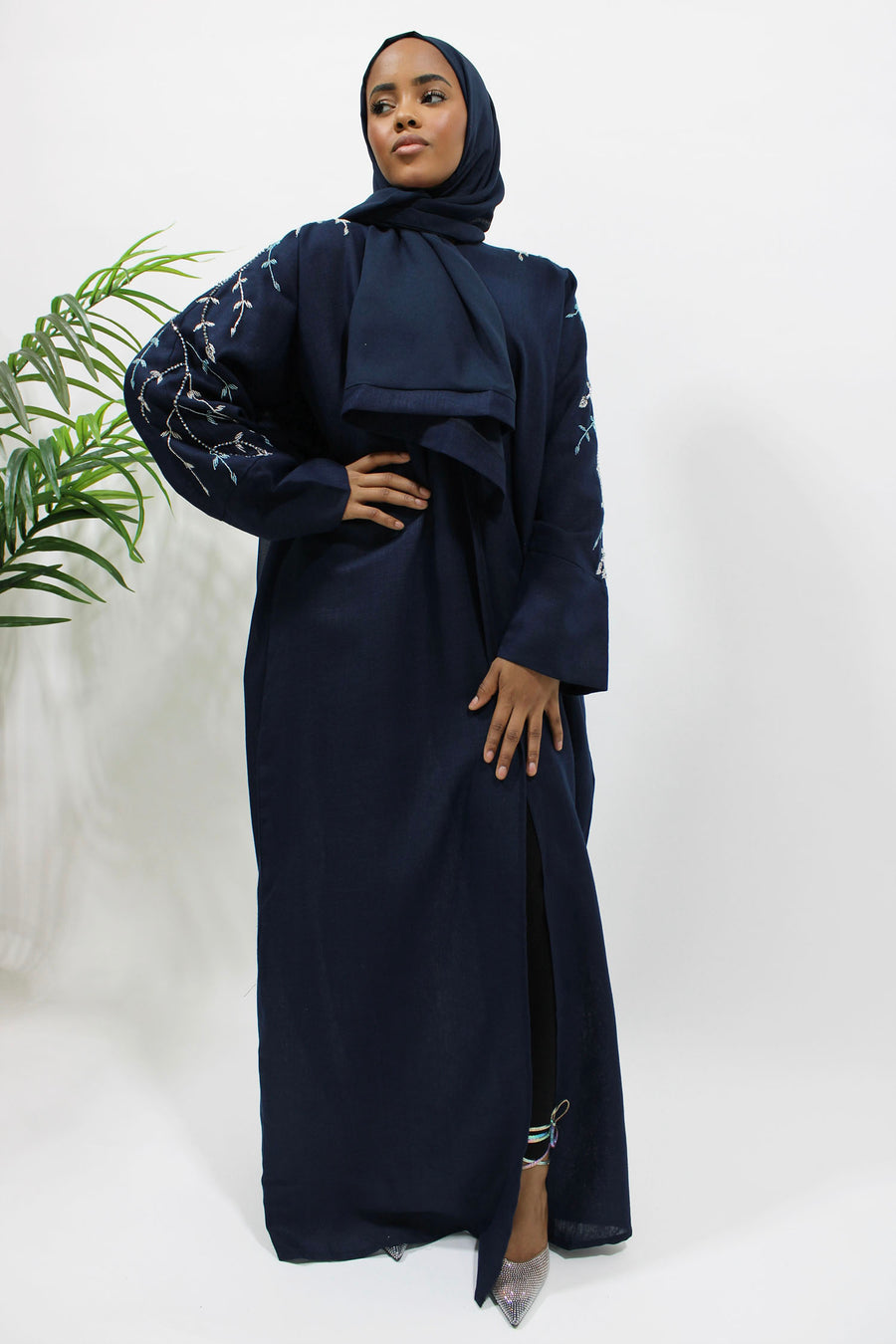 Navy blue bisht abaya showing its clean open bisht silhouette
