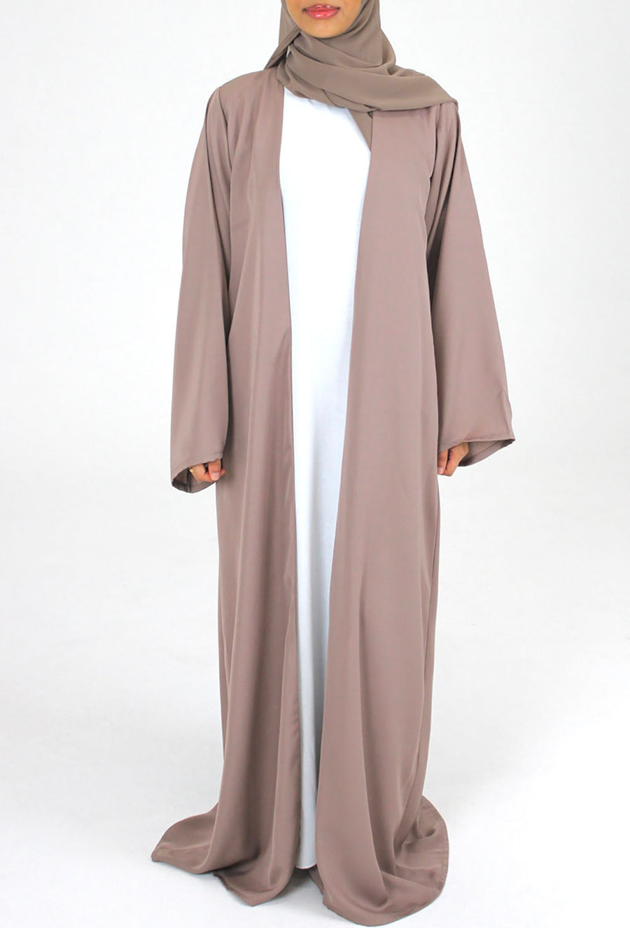 Woman wearing Amani's mocha duster style open abaya with scarf