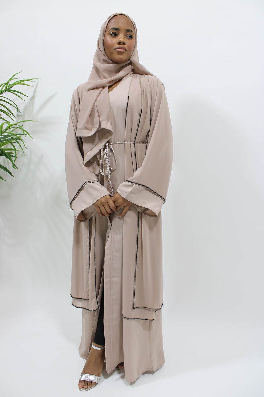 Full-length view of the nude double layer open abaya with matching hijab and belt