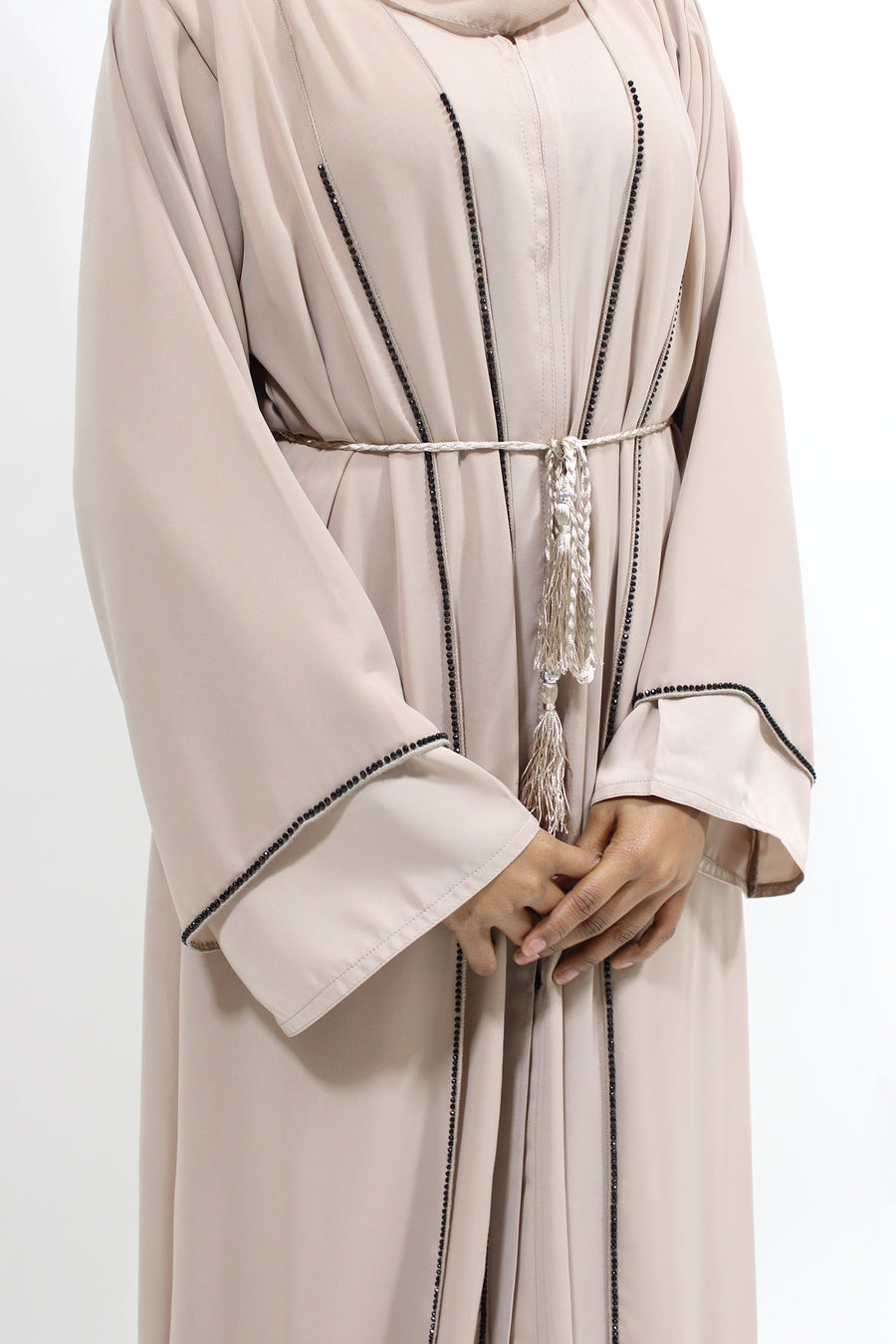 Nude double layer abaya belted at the waist for a defined shape