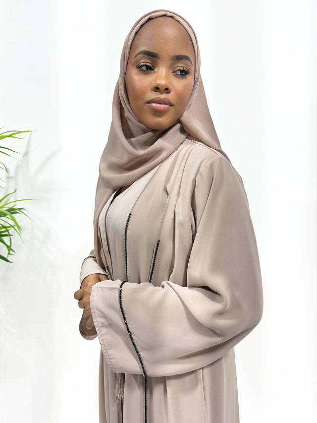 Nude double layer open abaya with black embellished piping and matching hijab, front view