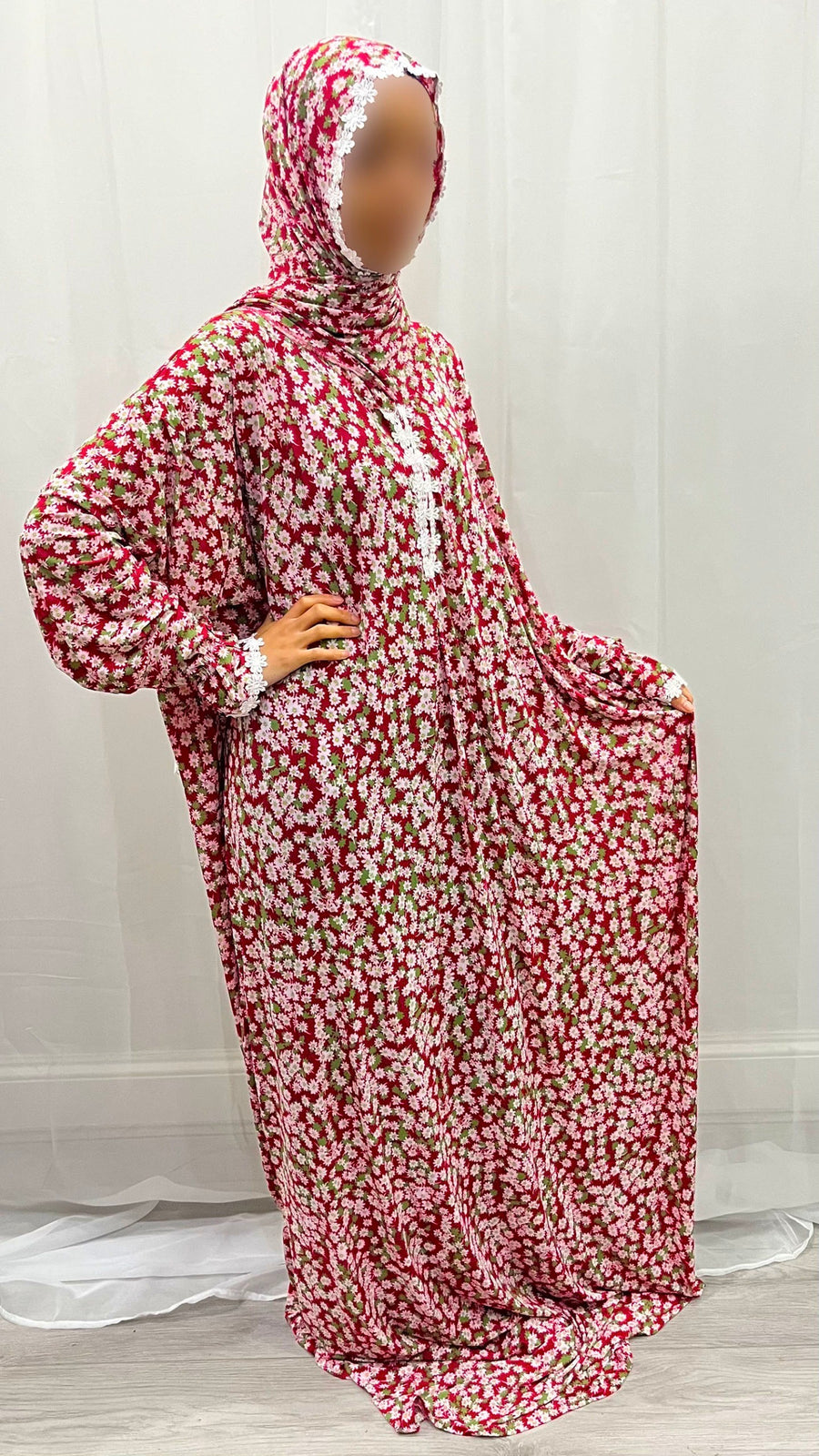 Crimson red floral prayer dress showing the lace trim detail