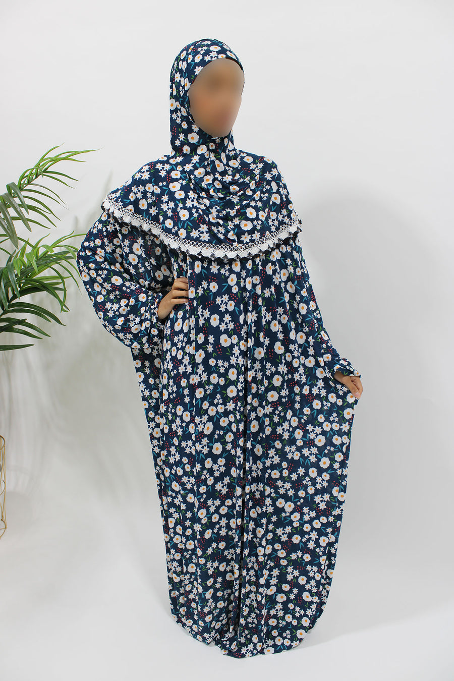 Navy floral jersey prayer dress showing the attached hijab