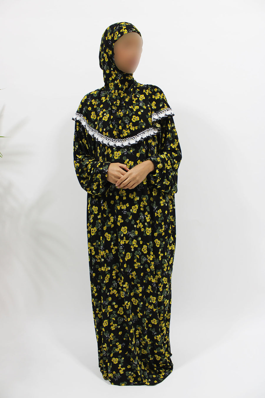 Yellow floral jersey prayer dress showing the attached hijab