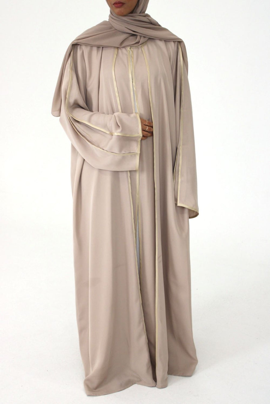 Satin piping edge detail on the beige open abaya