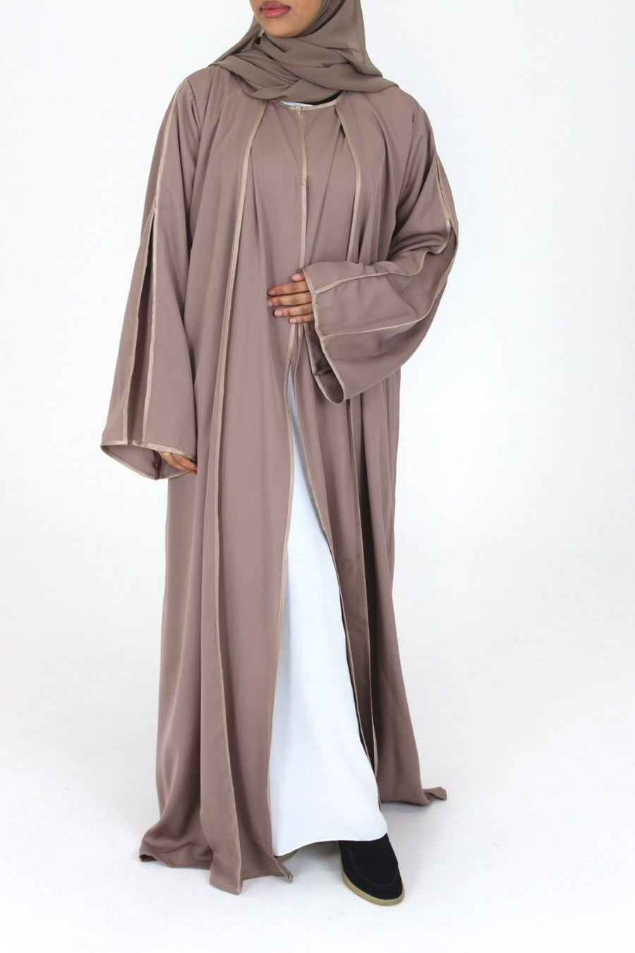 Woman wearing Amani's rose taupe open abaya with satin piping and scarf