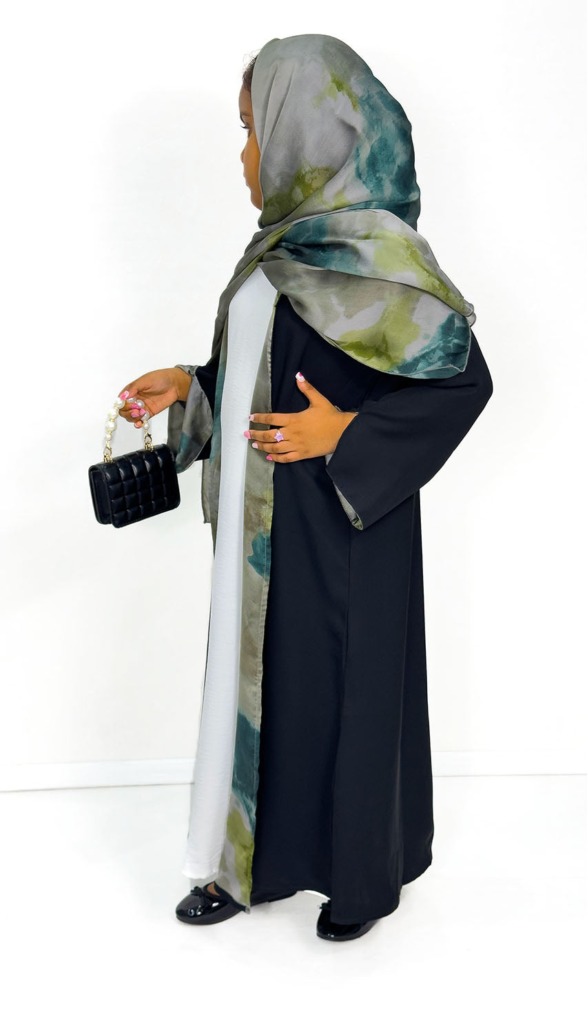 Girls' open abaya showing green watercolour satin chiffon lining