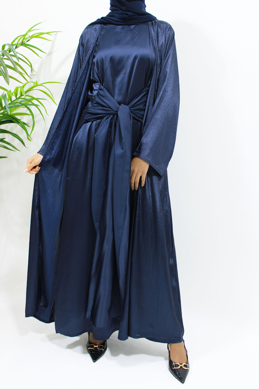 Navy three-piece abaya set styled with matching hijab for occasions